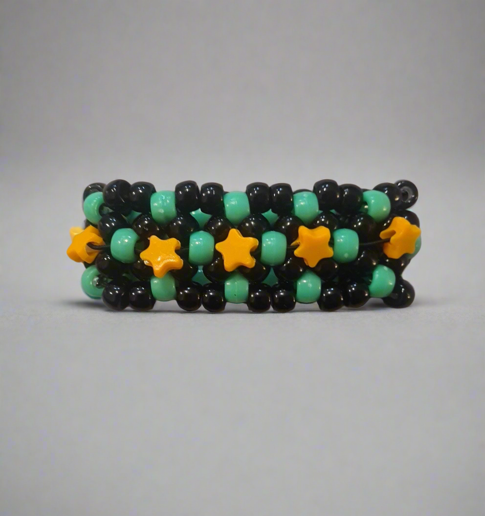 Black & Green Kandi Bracelet with Orange Stars