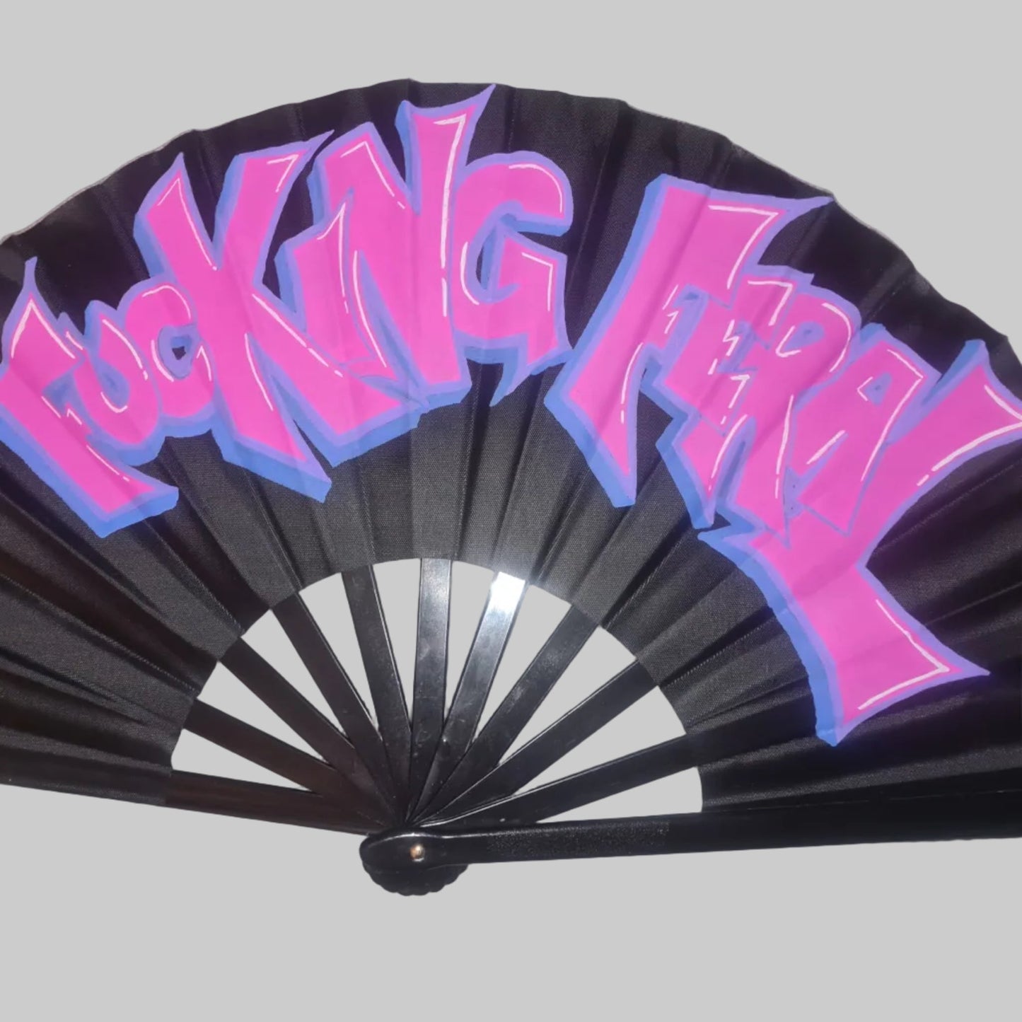 Fucking Feral UV Fan, black handpainted with purple graffiti lettering,blue outline, UV reactive for festivals and raves