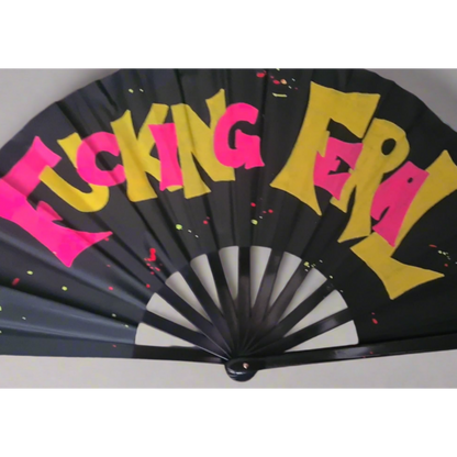 Fucking Feral UV Fan, black handpainted withpink and yellow graffiti lettering and multicoloured paint splatters, UV reactive for festivals and raves
