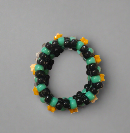 Black & Green Kandi Bracelet with Orange Stars