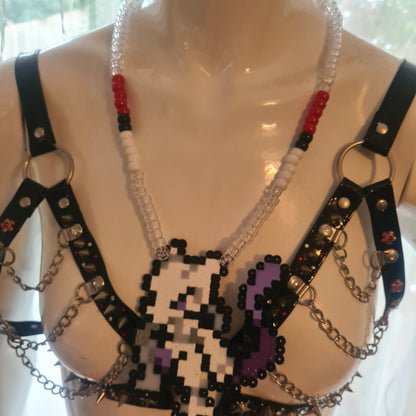 Pixelated character necklace on mannequin