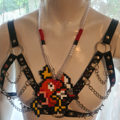 Pixelated character necklace on mannequin