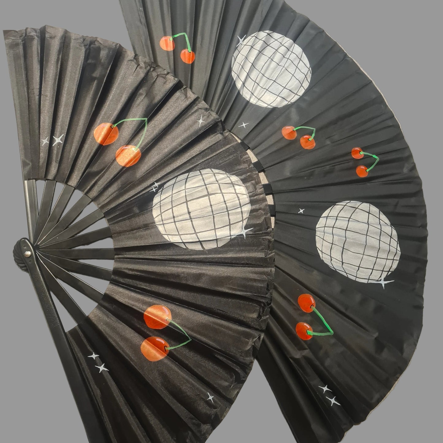 Two Rave Fans, black handpainted with silver discoballs and red cherries, for festivals and raves
