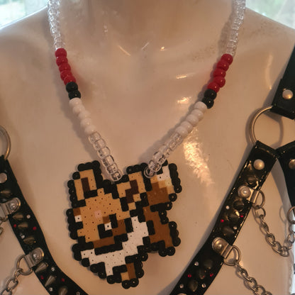 Pixelated character necklace on mannequin